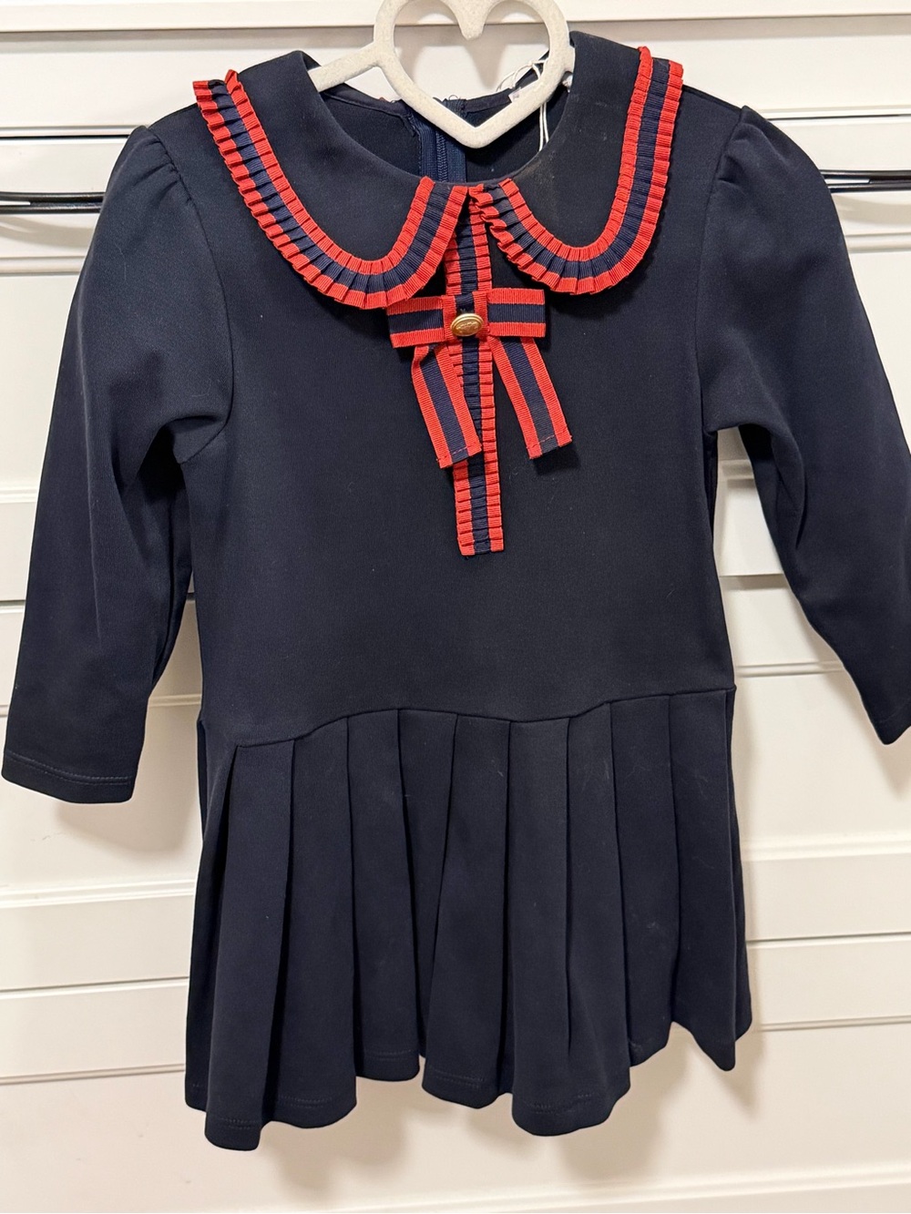 Navy Girls Pleated Dress with Red Ribbon Trim